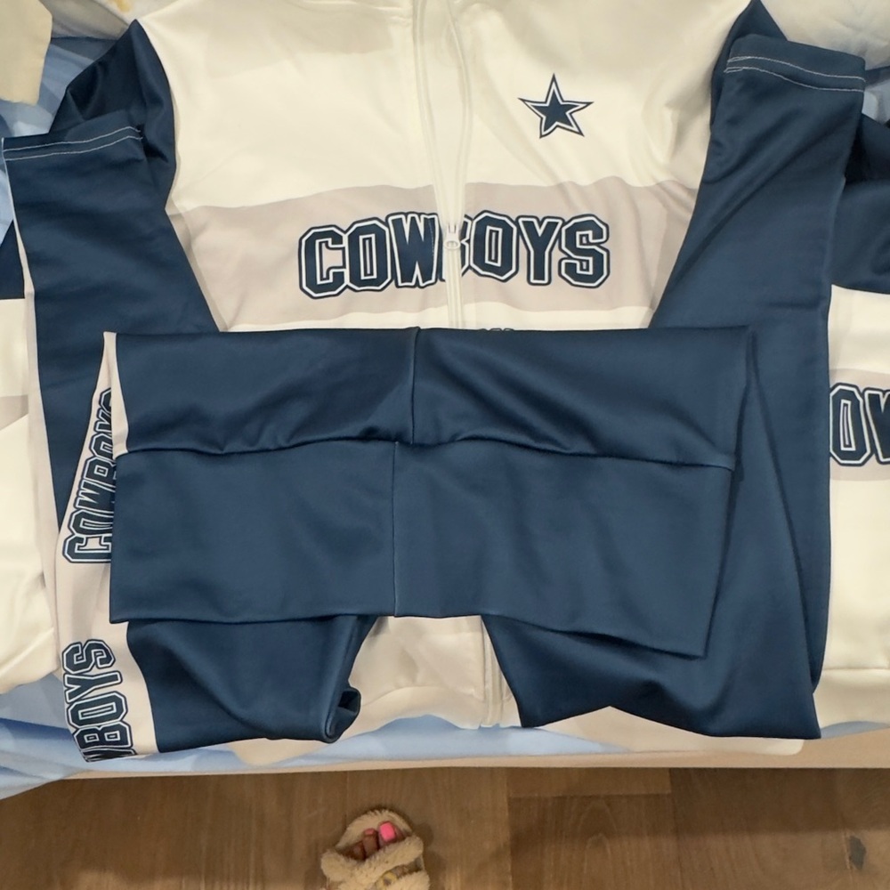 Cowboys tracksuit  , runs small, more like an extra small